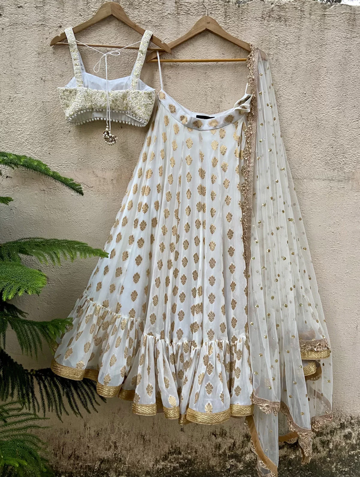 Ivory Ruffle Lehenga Set with Thread Work Bustier - Image 3